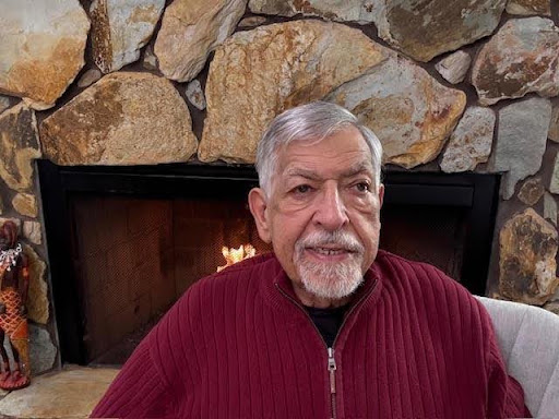 Dr. Richard C. Horowitz, parenting educator and author of Family Centered Parenting, speaking while seated in front of a stone fireplace.